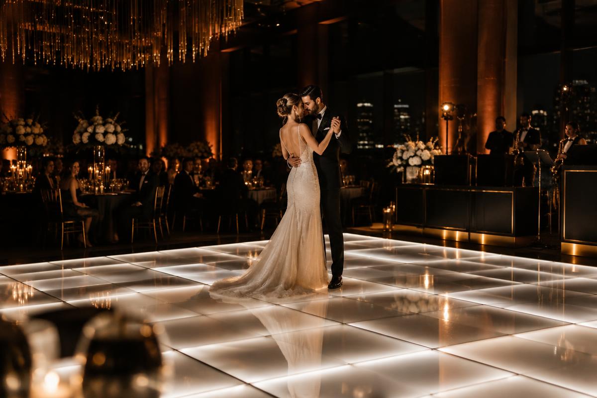 A couple’s first dance on a glowing LED dance floor